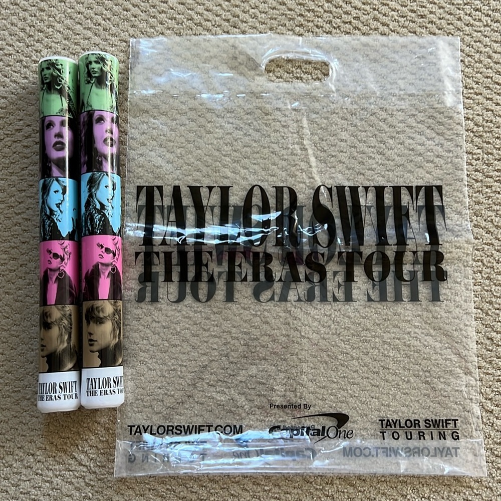 2 Eras Tour glow sticks (never used) and clear merch bag.
